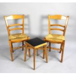 A Pair of Rush Seated Ladderback Side Chairs and a Similar Square Topped Stool