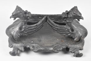 A Black Painted Coalbrookdale Cast Iron Boot Scraper with Griffin Head Decoration, 45cm wide