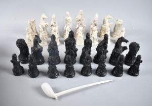 A Cast Resin Chess Set, the Kings 13.5cm high Together with a Vintage Clay Pipe