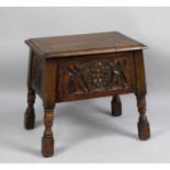 An Edwardian Oak Lift Top Sewing Box with Carved Panels all Round, 48cm wide