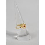 A Gold Ring with Central Ruby Flanked by Two White Stone, 2g, Size N