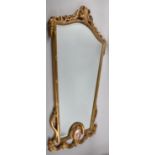 A Late 20th Century Ornate Gilt Framed Mirror with Scrolled Swag Border, 87x58cm