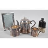 A Three Piece Silver Plated Tea Service, Silver Plated Photo Frame and a Hip Flask