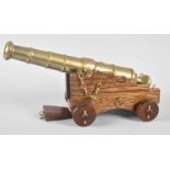 A Late 20th Century Wooden and Brass Model of a Ship's Cannon, 30cm long