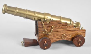 A Late 20th Century Wooden and Brass Model of a Ship's Cannon, 30cm long