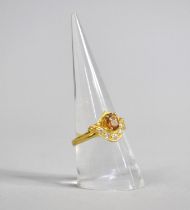 A 22ct Gold Ring with Central Citrine Stone Surmounting Band of Five White Stones, Stamped 916, Size