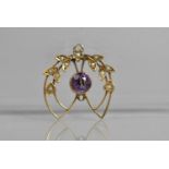 An Edwardian 9ct Gold, Seed Pearl and Purple Stone Pendant in the Art Nouveau Taste, 1.8g 2x2.5cm