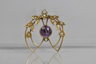 An Edwardian 9ct Gold, Seed Pearl and Purple Stone Pendant in the Art Nouveau Taste, 1.8g 2x2.5cm