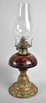 A Late Victorian Brass and Overlaid Ruby Glass Oil Lamp with Plain Chimney, 37cm high