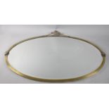 A Mid 20th Century Oval Brass Framed Wall Mirror with Vase and Swag Decoration, 81x61cm