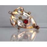 An Edwardian Art Nouveau 9ct Gold Pendant of Organic Form Having Central and Drop Facit Cut Red