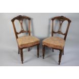 A Pair of 19th Century Walnut Side Chairs with Carved and Pierced Backs, Upholstered Seats and