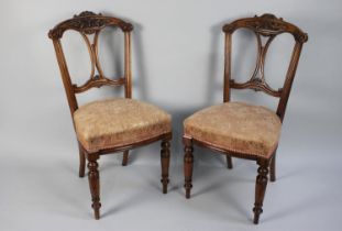 A Pair of 19th Century Walnut Side Chairs with Carved and Pierced Backs, Upholstered Seats and