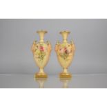 A Pair of Royal Worcester Blush Ivory Vases decorated with Floral Bursts to Body and with Satyr Mask