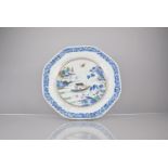 An 18th Century Porcelain Charger, Qianlong Period decorated with River Village Scene in Under