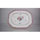 An 18th Century Chinese Porcelain Export Platter decorated with Central Floral Bursts and Pink