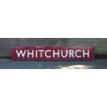 A Large Vintage Enamel Railway Station Sign, "Whitchurch" in White on Burgundy Ground, 300cm wide