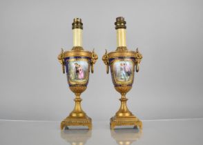 A Pair of Sevres Style Porcelain and Gilt Bronze Mounted Urn Shaped Table Lamps with Goat Mask