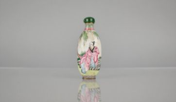 A Chinese Enamel on Copper Snuff Bottle decorated in the Famille Rose Palette with Robed Figure in