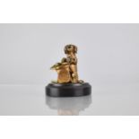 An Early 20th Century Bronze Match Holder in the Form of a Begging Anthropomorphic Dog with Hat,