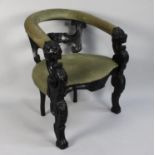 A 19th Century Ebonised Oak Desk Chair with an Upholstered Yoke-Back Rail over Carved Back Splat and