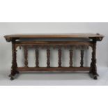 A Gothic Oak Side Table with Carved Decoration, 174x75x82cm high