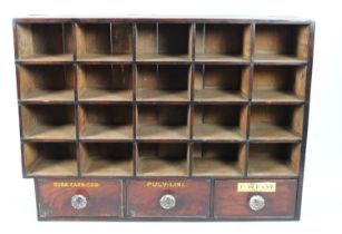 A Bank of 19th Century Apothecary Shop Pigeon Holes and Three Drawers with Glass Knobs, 23x101x73cms