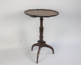 An Early George III Mahogany Tripod Wine Table with a Carved Pie Crust Top over a Turned Stem and