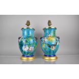 A Pair of French Majolica Lamps of Baluster Form decorated with Flowers, Birds and Butterflies on