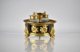 A Regency Bronze and Gilt Ink Stand of Circular Footed Form complete with Two Cut Glass Inkwells