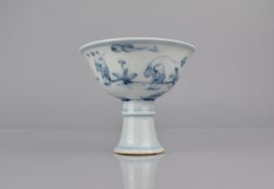 A Chinese Porcelain Blue and White Stem Cup decorated with Children at Play in Garden Setting,