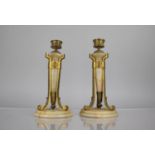 A Pair of French Gilt Metal and Alabaster Lamps of Conical Form with Scrolled Footed Tripod Supports