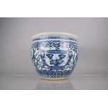 An Early Chinese Porcelain Blue and White Fishbowl Planter Decorated In the Round with Servant