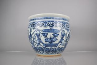 An Early Chinese Porcelain Blue and White Fishbowl Planter Decorated In the Round with Servant