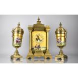 A Late 19th/Early 20th Century French Gilt Metal and Porcelain Garniture, The Clock of Architectural