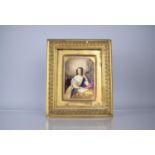 An Early 19th Century Hand Painted Porcelain Plaque depicting Maiden Seated at Table Reading, The