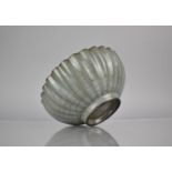 A Chinese Celadon Crackle Glazed Bowl of Reeded Form, 19cms Diameter, 8cms High