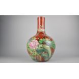 A 20th Century Chinese Bottle Vase Decorated in Relief with Peacocks and Flowers on Red Ground, Seal