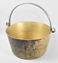 A Vintage Brass Jam Kettle with Steel Loop Handle, 29.5cms Diameter