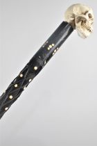 A Colonial Walking Cane with Bone Studding and Replacement Skull Handle, 78cms Long