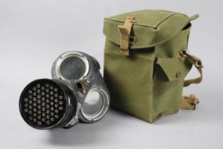 A Vintage Gas Mask in Canvas Carrier