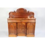 A Victorian Mahogany Sideboard with Two Short Drawers over Inverted Breakfronted Cupboards to