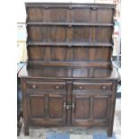 A Mid 20th Century Ercol Dresser with Panelled Cupboard Two Door Base Surmounted by Two Drawers