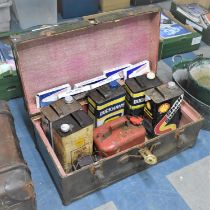 A Vintage Metal Mounted Travelling Trunk Containing Oil Cans to include Shell, Duckhams Etc Together