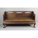 A Chinese Carved Hardwood Settle with Carved and Pierced Panel Back with Birds in Branches