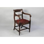 A Victorian Mahogany Framed Armchair with Twisted Back Support and Reeded Scrolled Armrests