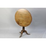 An Early 19th Century Elm Snap Top Tripod Table, Three Plank Circular Tilt Top on Tapering Support