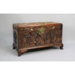 A Nicely Carved Camphor Wood Chest Decorated with Chinese Gods and Dragons in Exterior Setting,