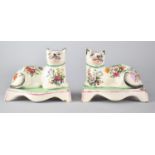 A Pair of 19th Century Stafford Pottery Studies of Recumbent Cats with Later Printed Floral