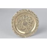 An Islamic White Metal Dish with Floral Repousse Decoration, 8.5cm Diameter
